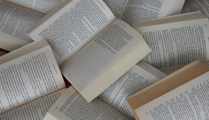 white and brown book on brown woven surface
